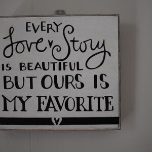 Cute Woden sign with hanging wire in the back